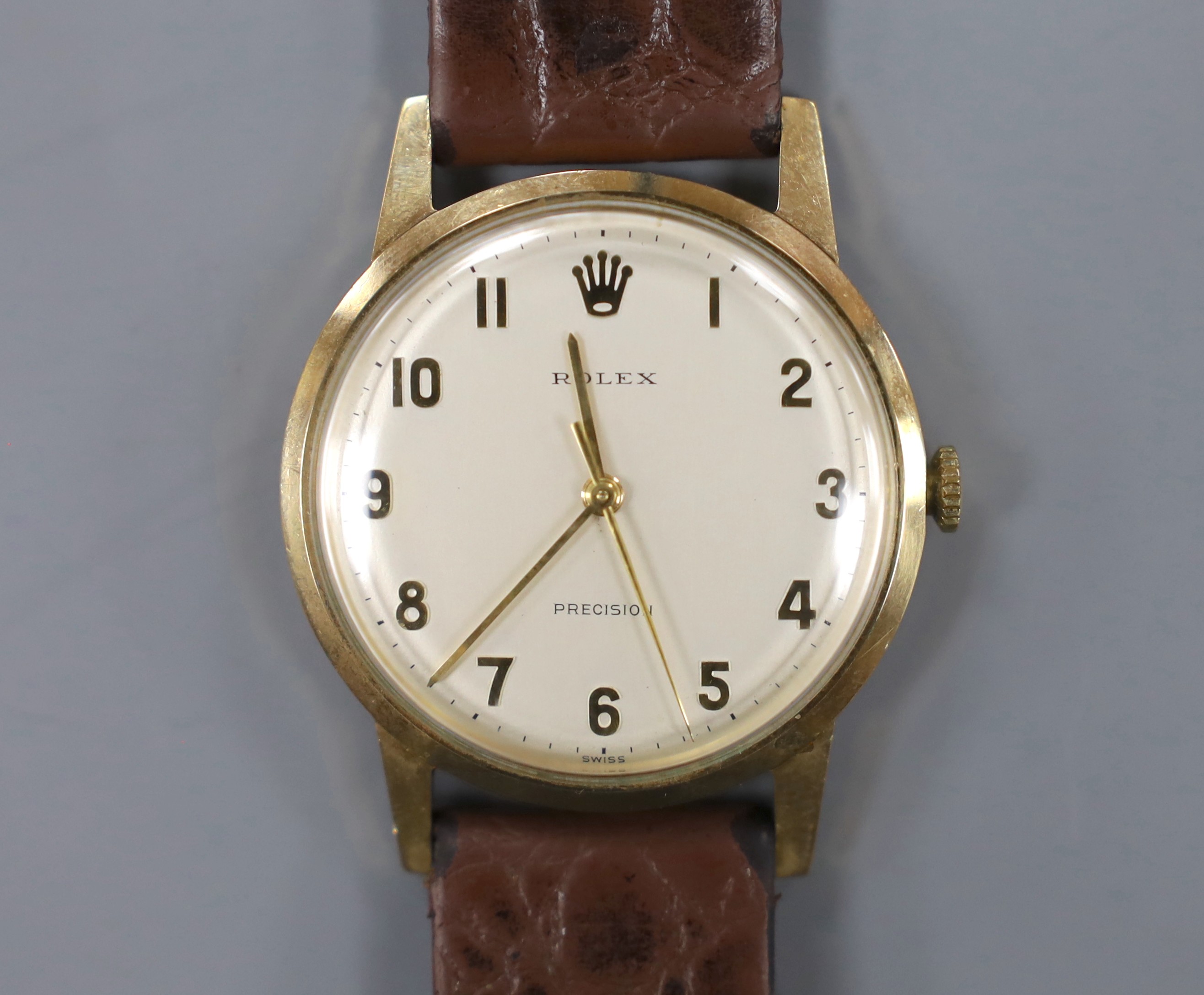 A gentleman's late 1960's 9ct gold Rolex precision manual wind wrist watch, with case back inscription, on associated leather strap, case diameter 34mm, gross weight 33.6 grams, with box and guarantee.